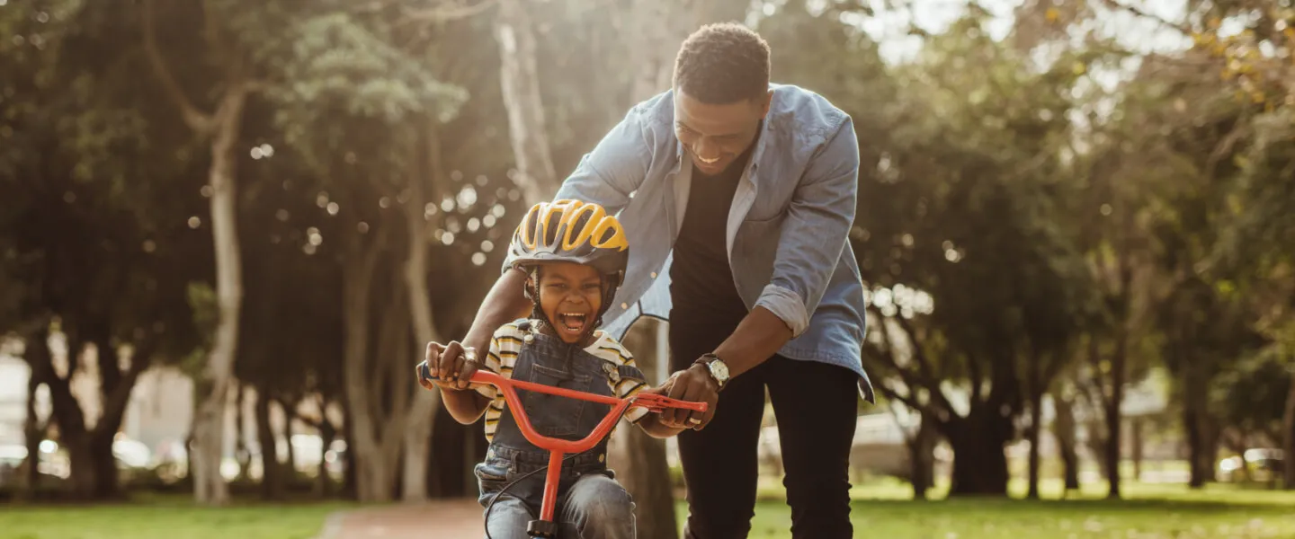 Man with child on a bike